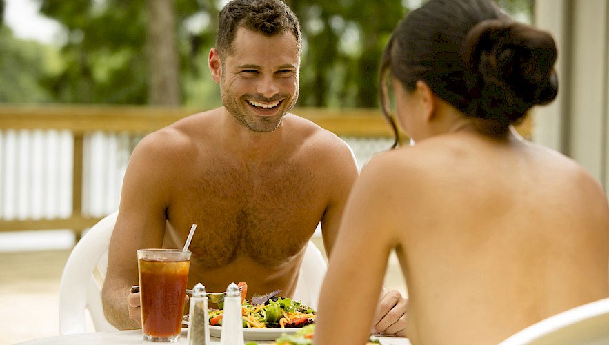 Couple dining on deck